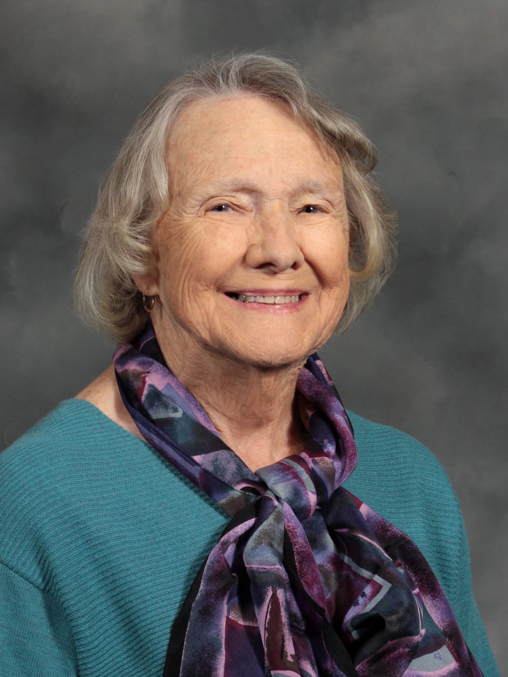 Woman with blue shirt and multi colored scarf (jpg)